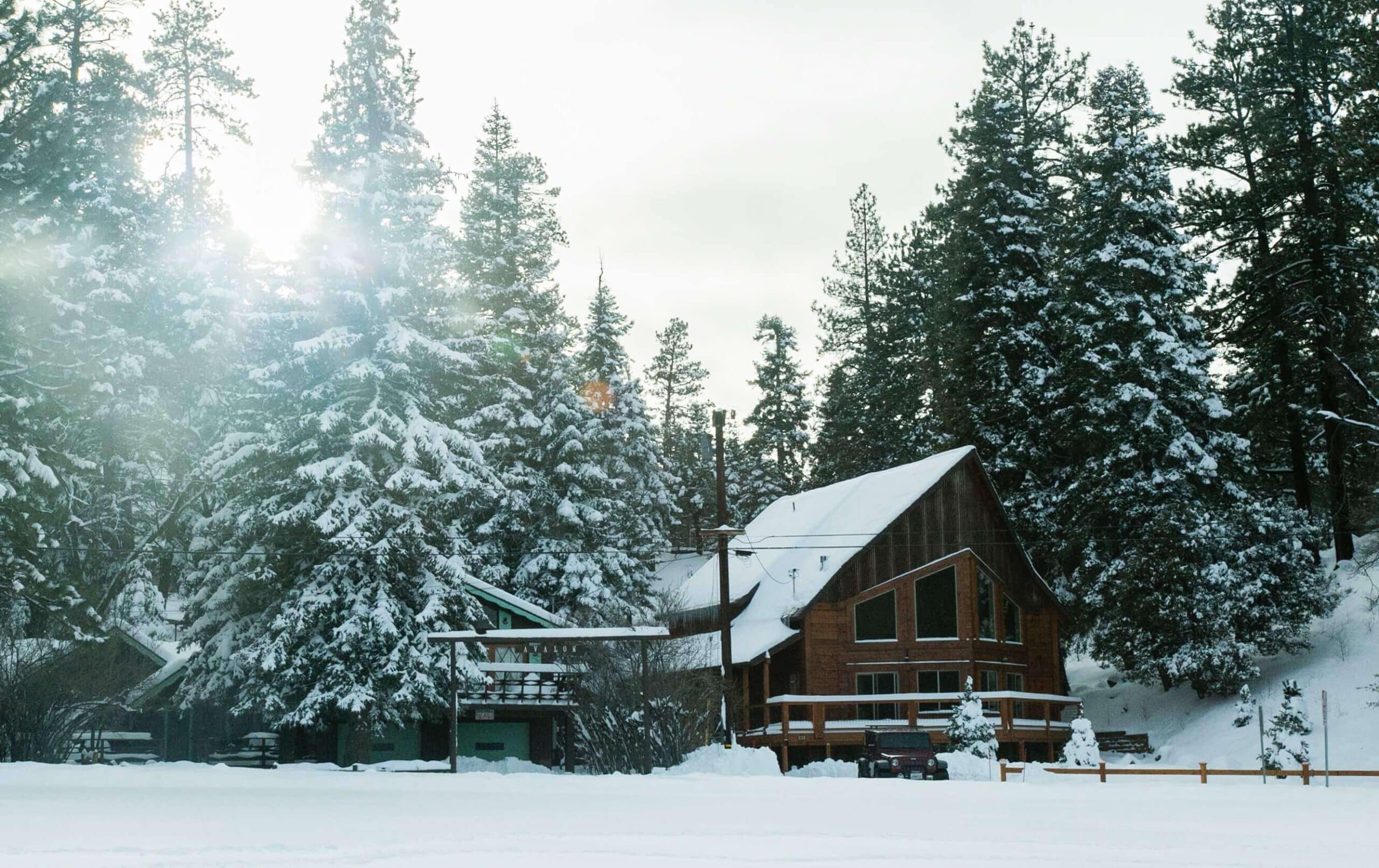 Big Snowy House Surrounded By Trees