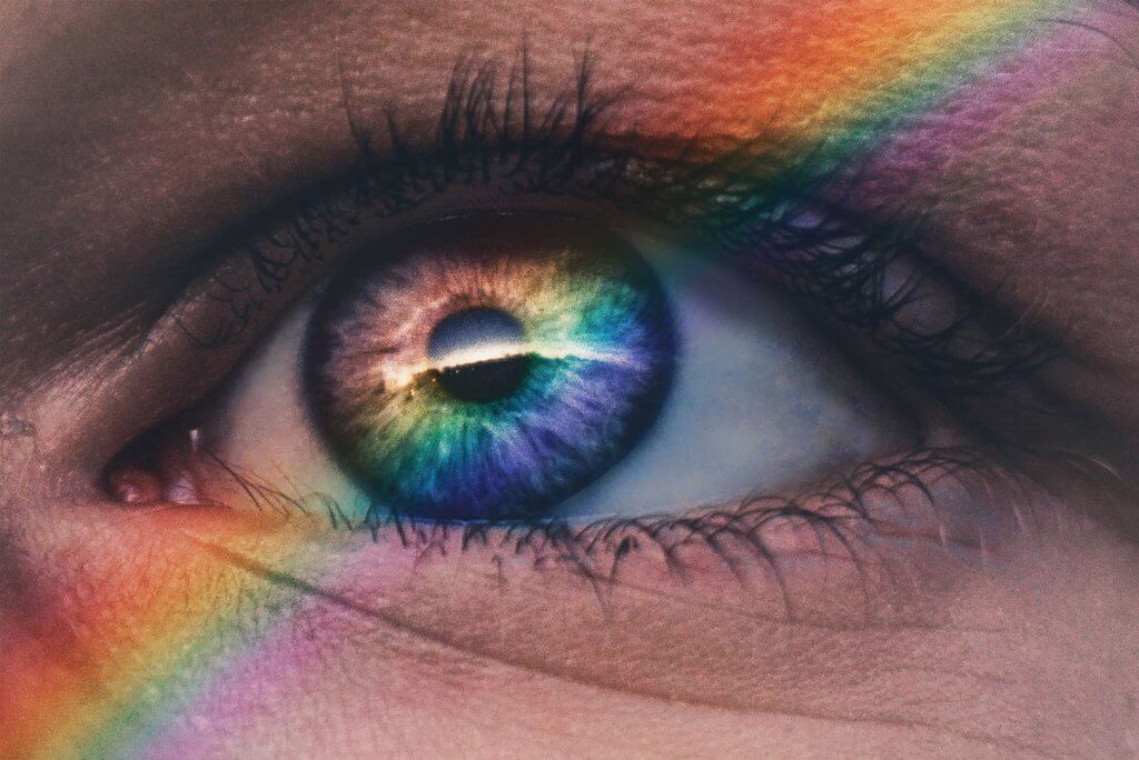 Person viewing rainbow wallpaper