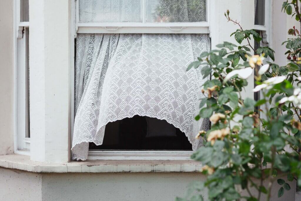 open window on a breezy day